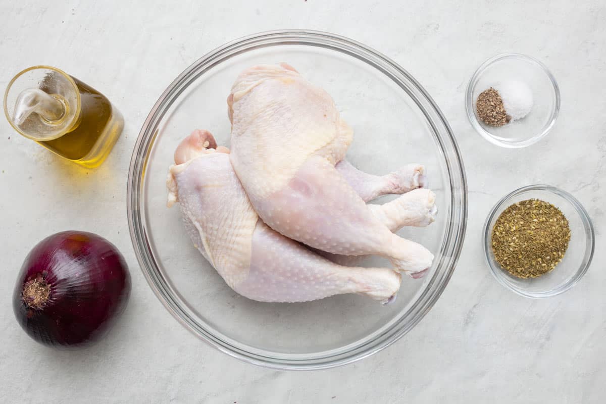 Ingredients for recipe: chicken legs, zaatar, olive oil, salt, pepper, and red onion.