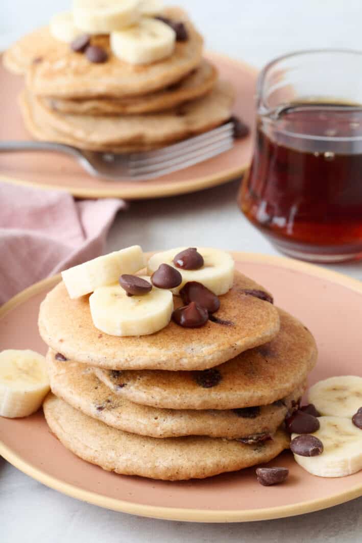 Stack of oat flour pancakes with bananas between the slices