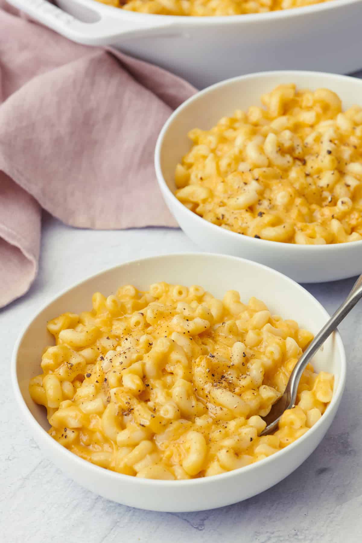 Two mug bowls of the butternut mac and cheese 