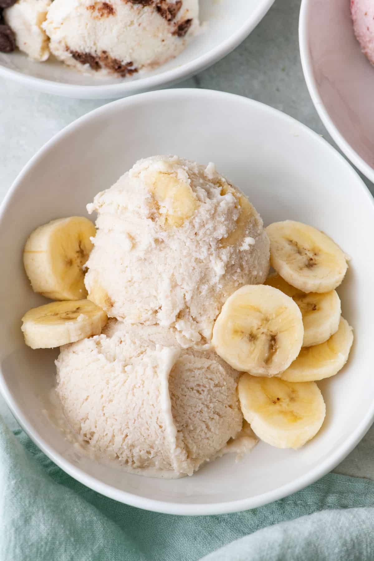 Banana cream cottage cheese ice cream with extra slices of banana on top.