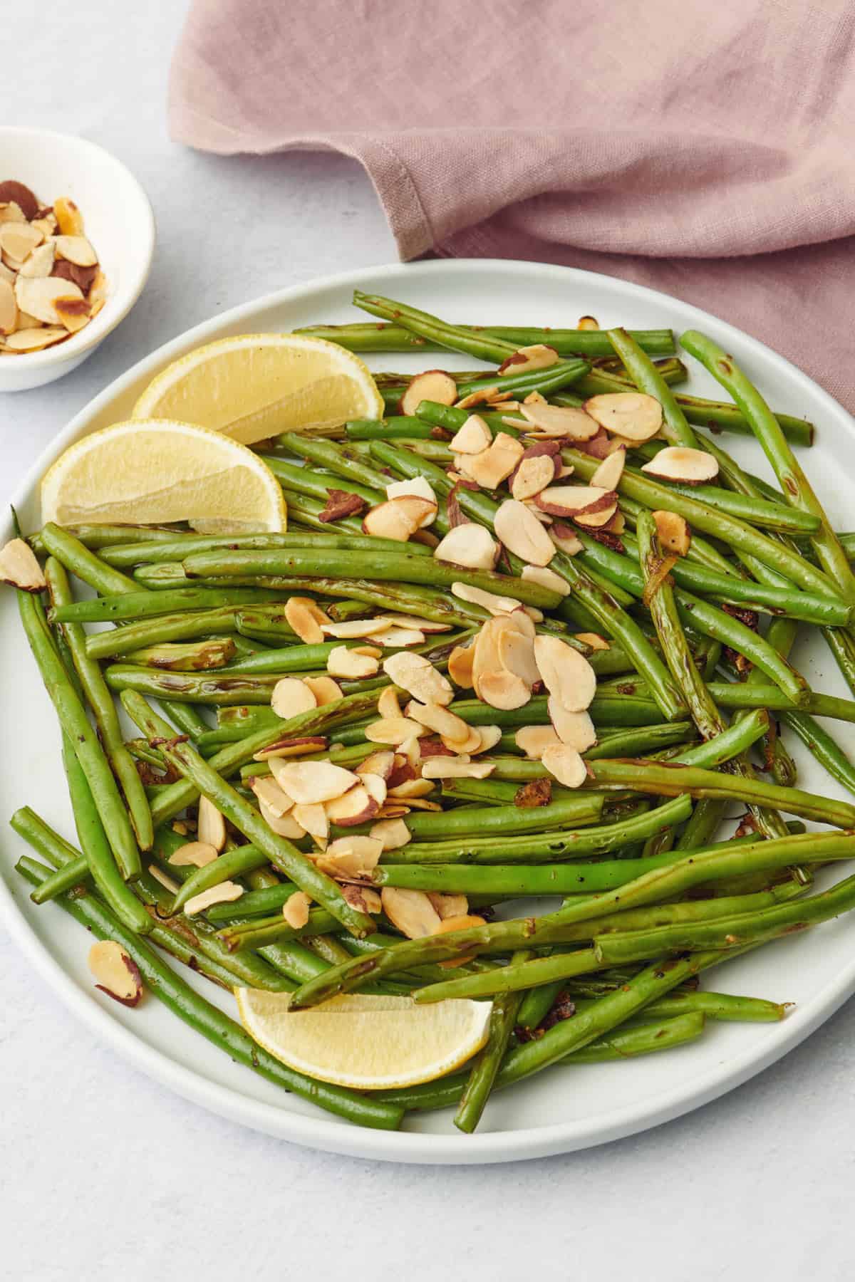 Large plate of green beans with almonds - Thanksgiving side dish