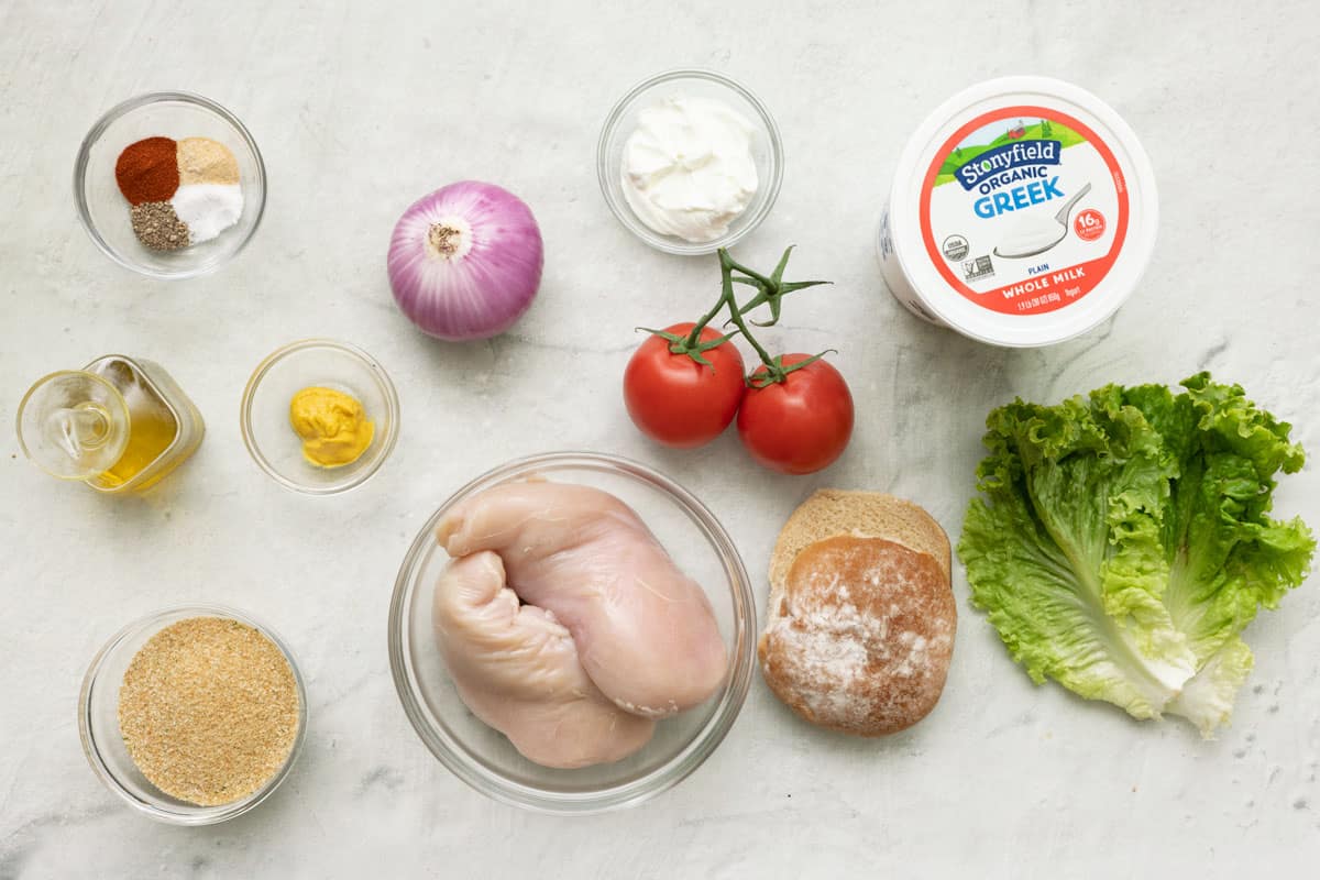 Ingredients for recipe: Stonyfield Organic Greek Yogurt, spices, onion, mustard, breadcrumbs, oil, and for assembly, tomato, lettuce, and burger buns.