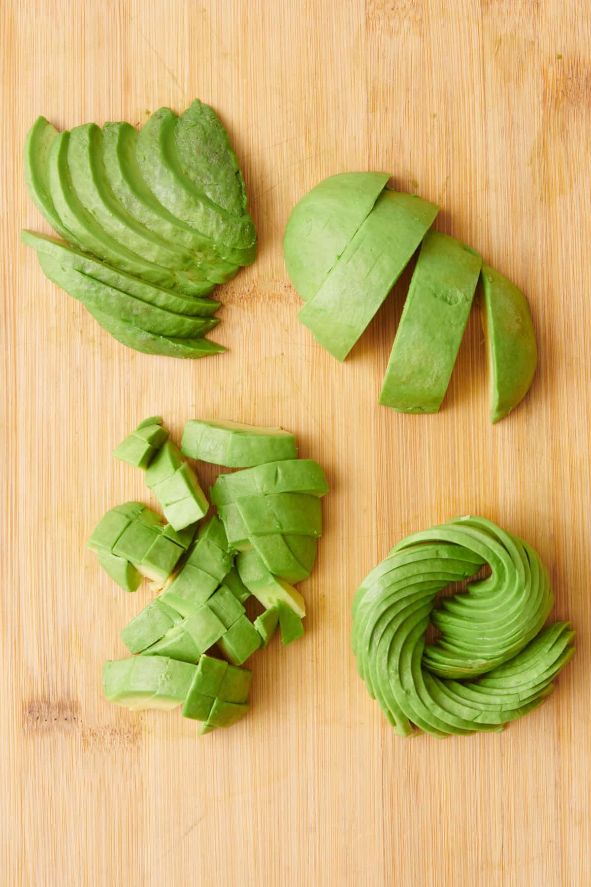 Avocado cuts 4 ways: slices, wedges, diced, and roses.