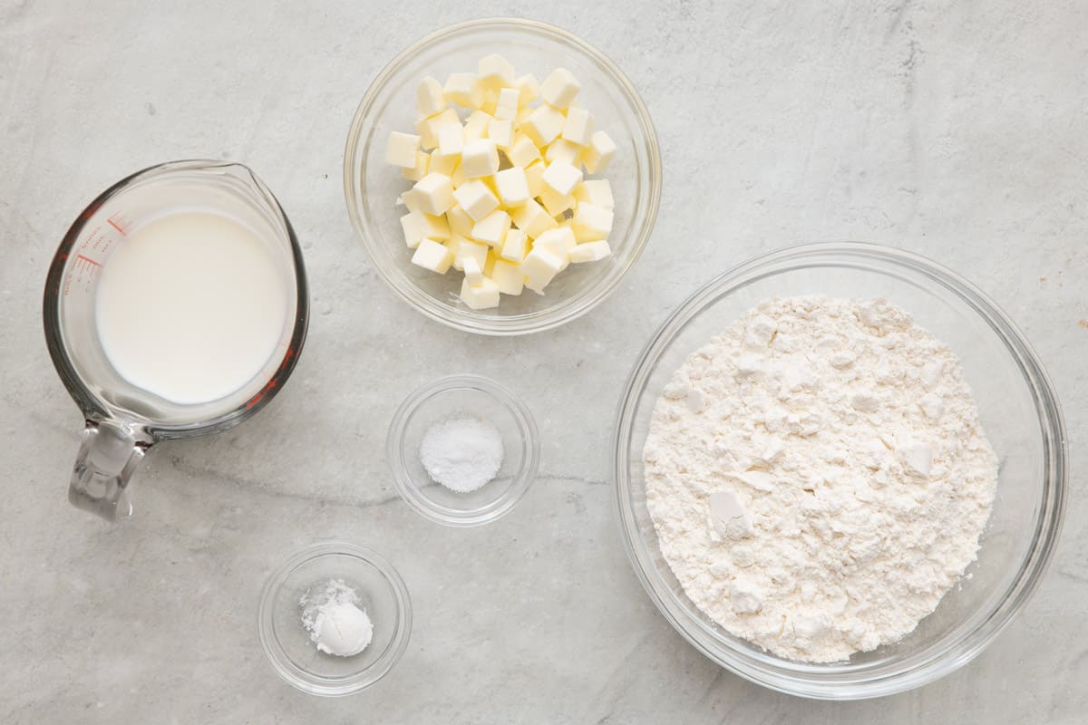 Ingredients for recipe: milk, cubed butter, salt, baking powder, and flour.