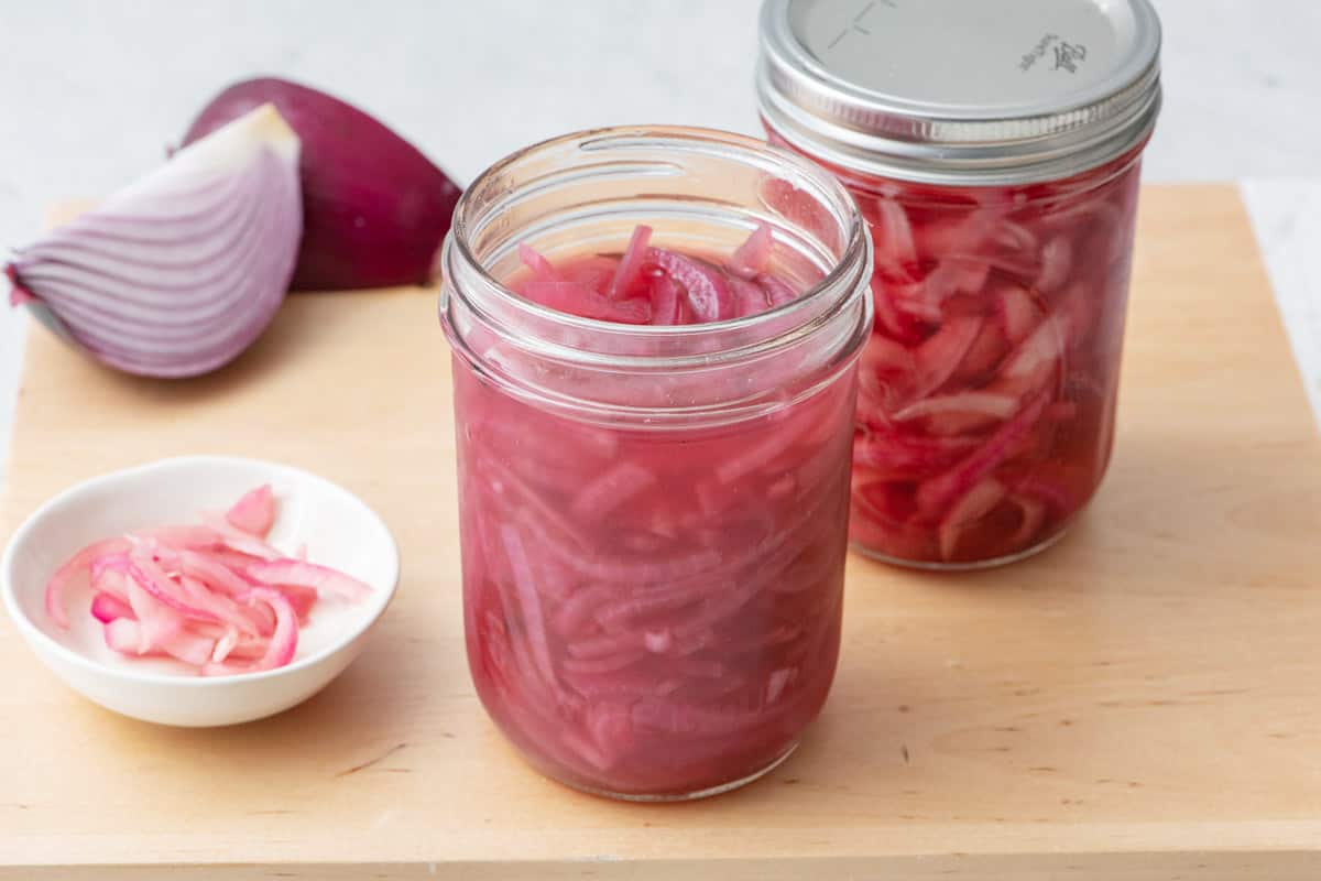 Clear jar with pickled onions the quick method