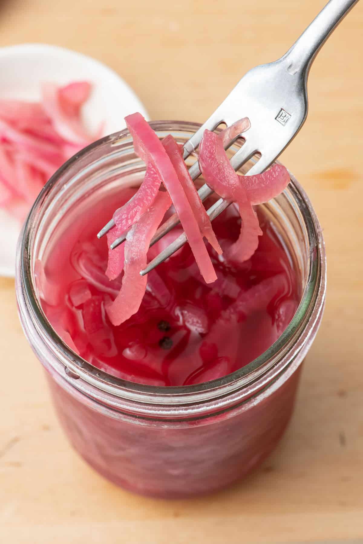 Pickled onions in a clear jar