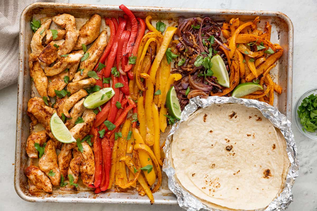 The cooked chicken fajitas on a sheet pan ready to serve