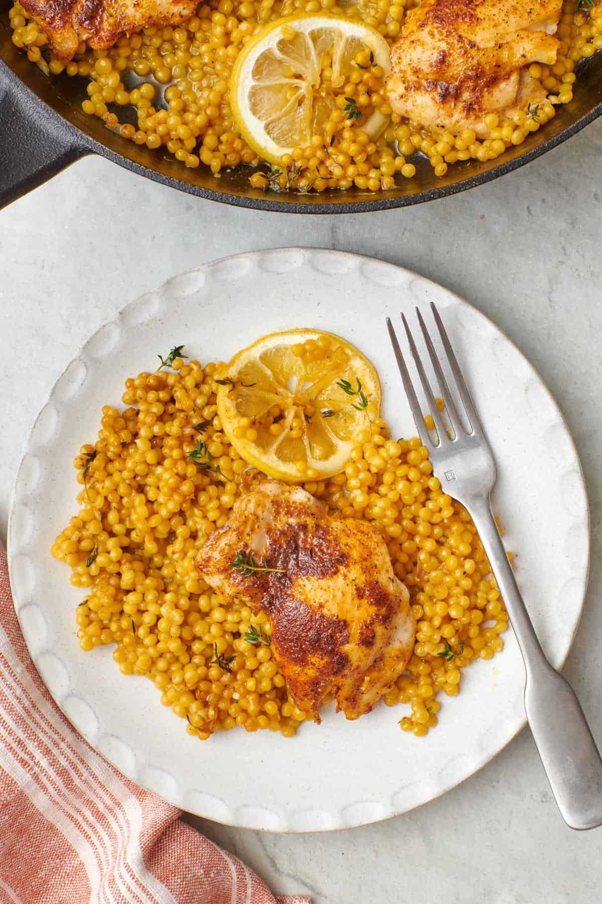 Final outcome of the skillet chicken with couscous shown in the cast iron skillet