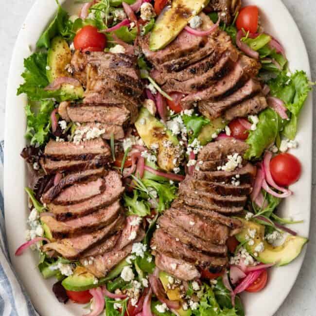 Steak salad on a large platter.