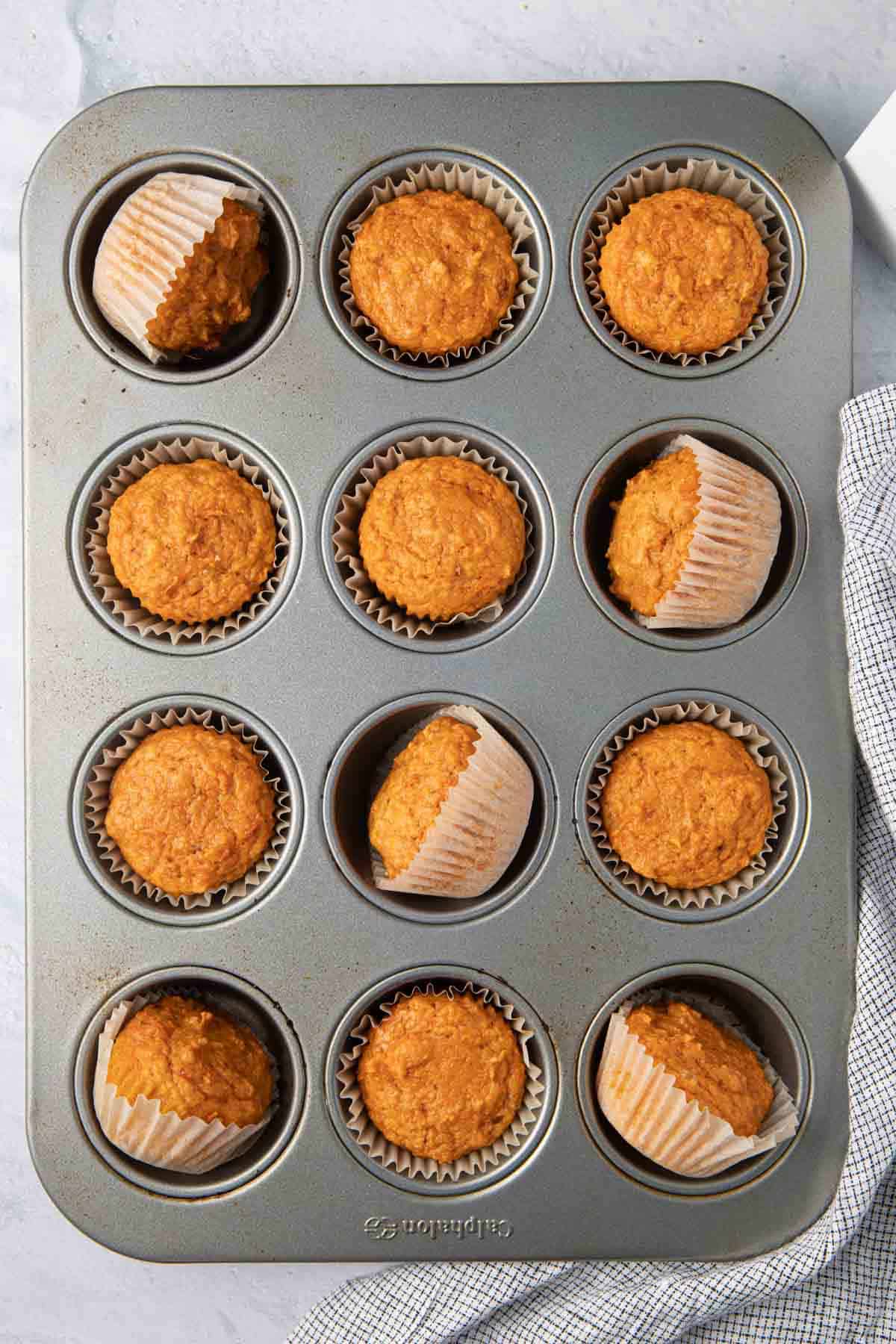 Close up shot of the sweet potato muffins with almond butter on the side