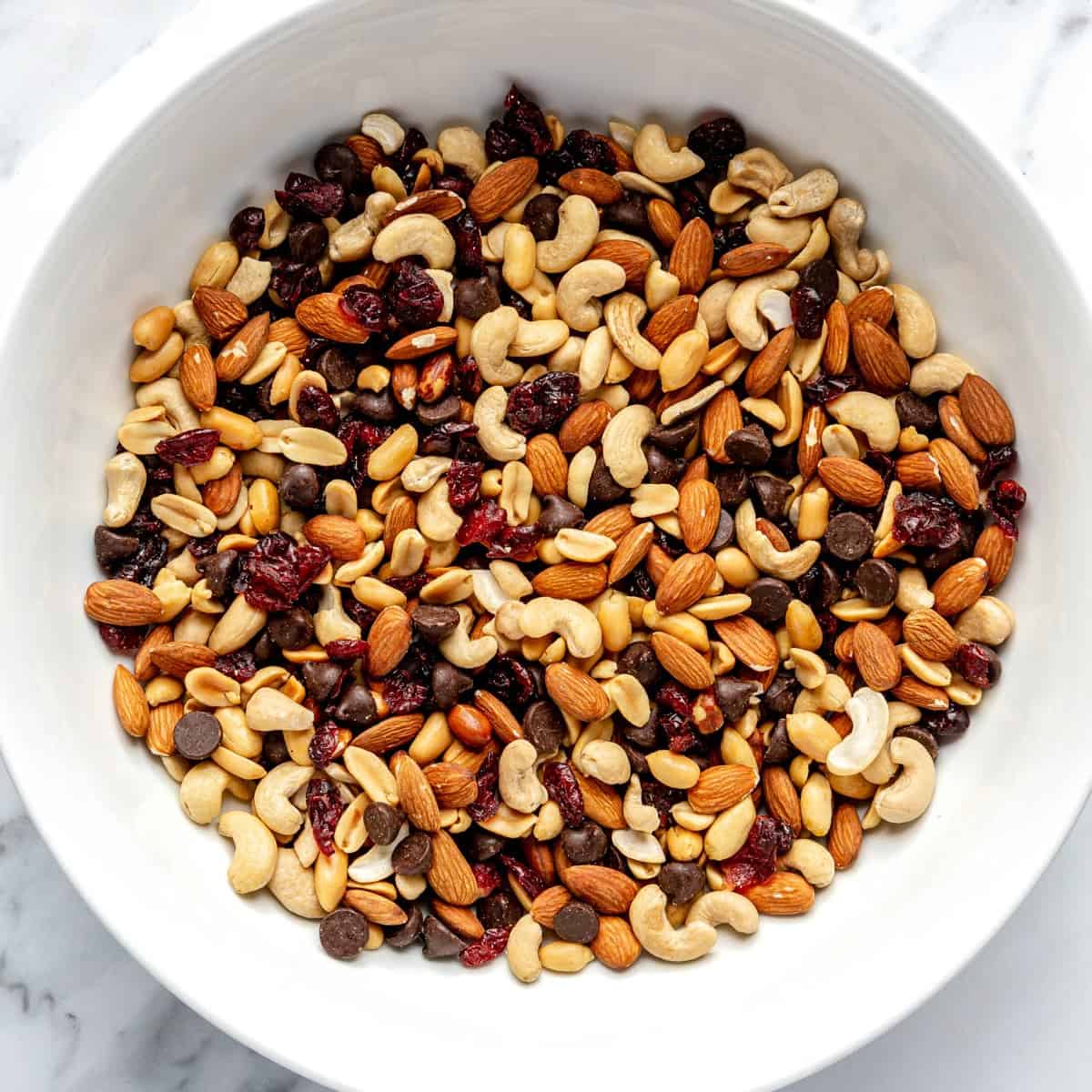 Trail mix in a mixing bowl.