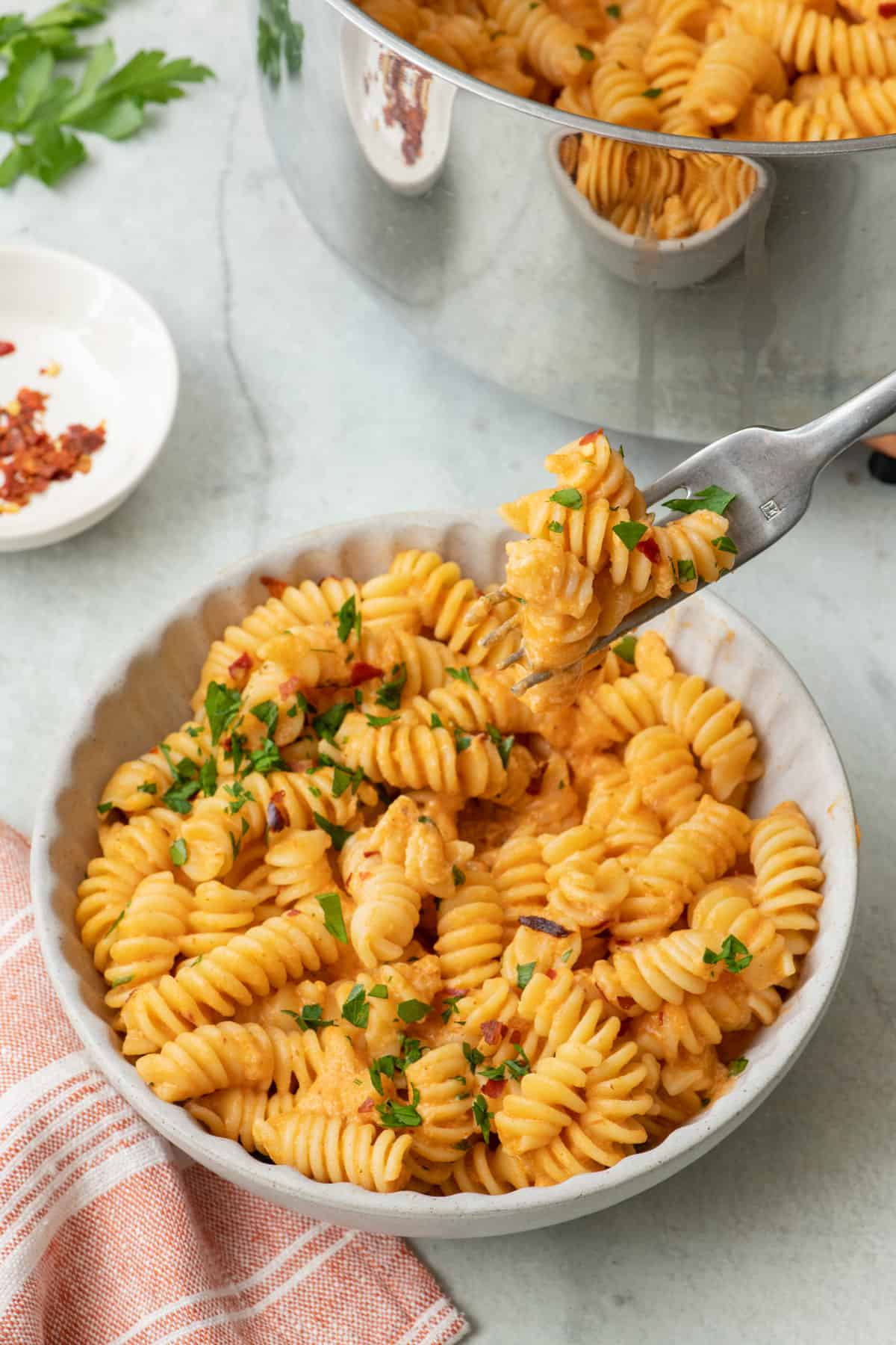 Cottage Cheese Tomato Pasta with a fork lifting up a bite.