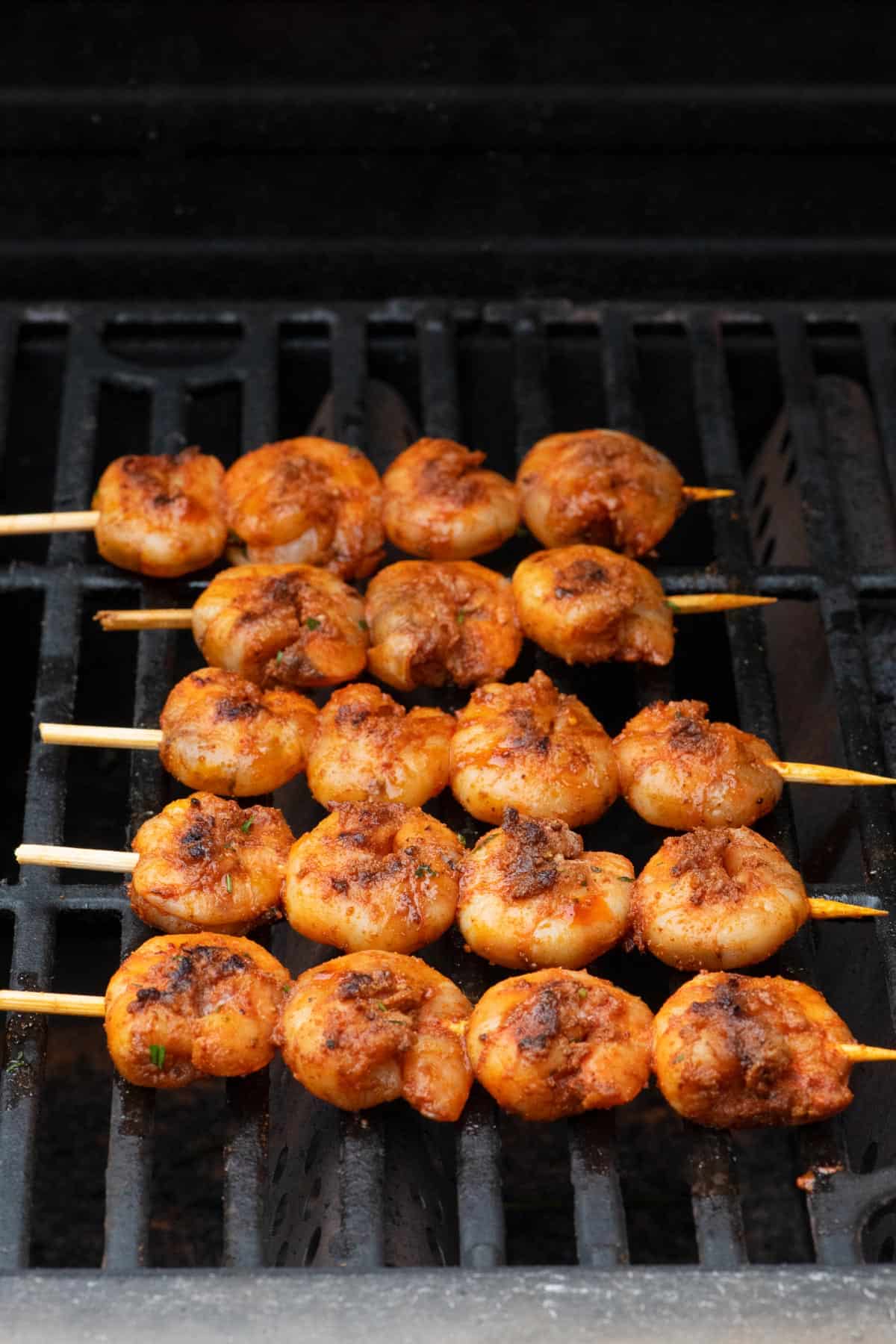 Shrimp skewers on a grill.