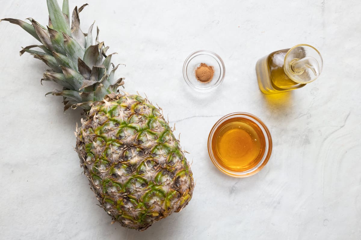 Ingredients for recipe: pineapple, cinnamon, oil, and honey.