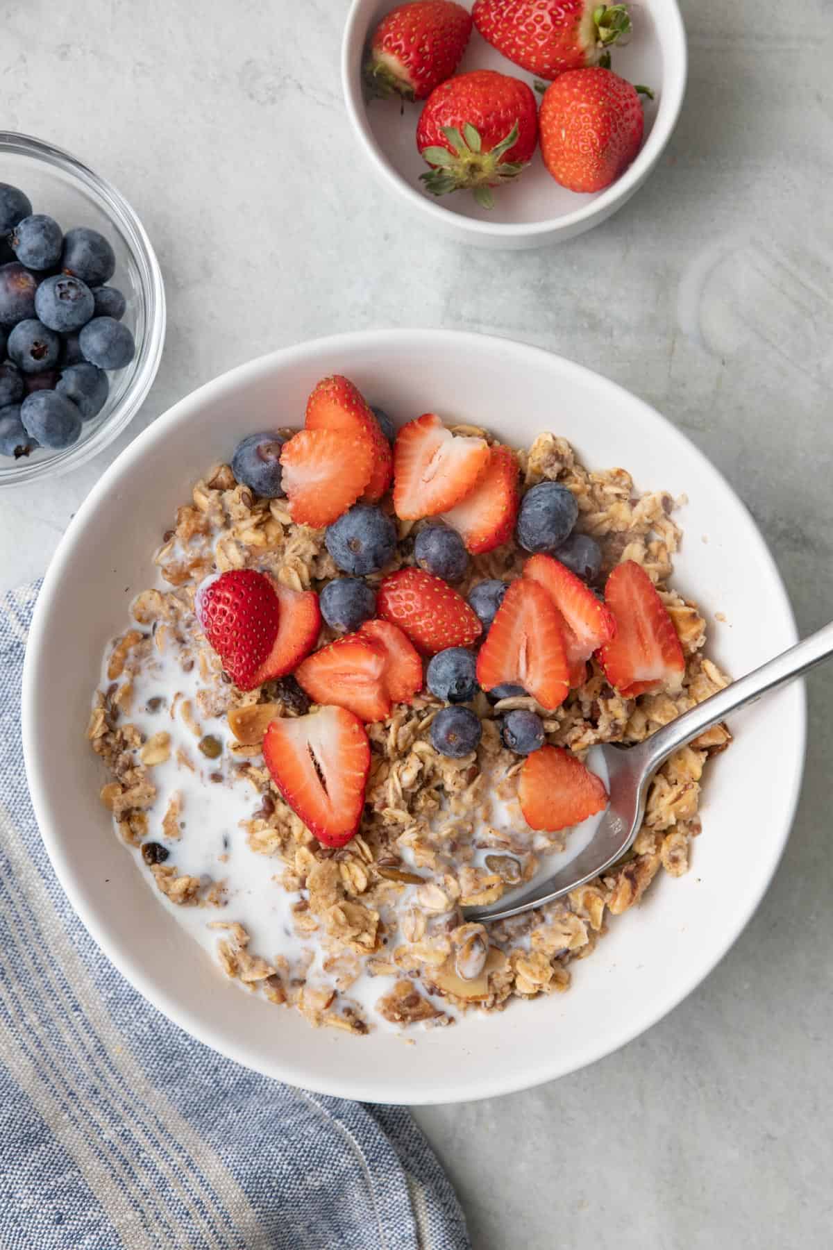 Muesli served hot with milk and fresh berries.