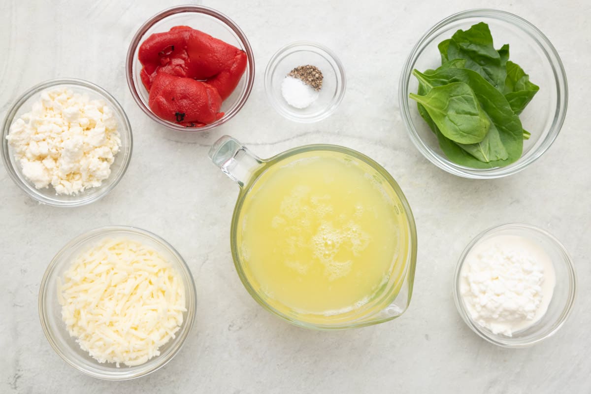 Ingredients for recipe: cottage cheese, mozzarella cheese, roasted red pepper, salt and pepper, egg whites, spinach, and ricotta.