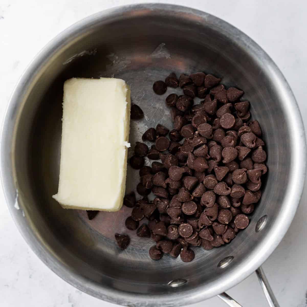 Chocolate chips and butter in bowl before melting.