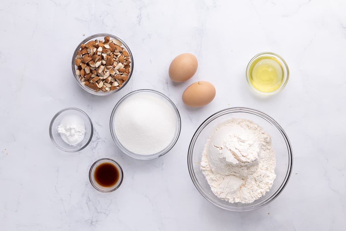 Ingredients for recipe: pecans, rising agents, vanilla, sugar, eggs, egg whites, and flour.