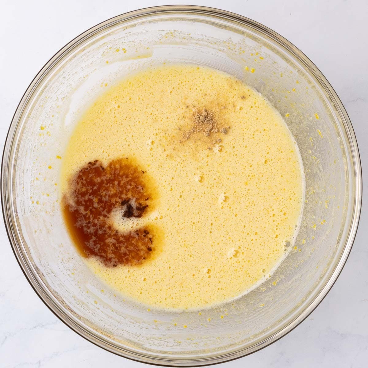 After whisking until pale yellow with ginger and vanilla added.