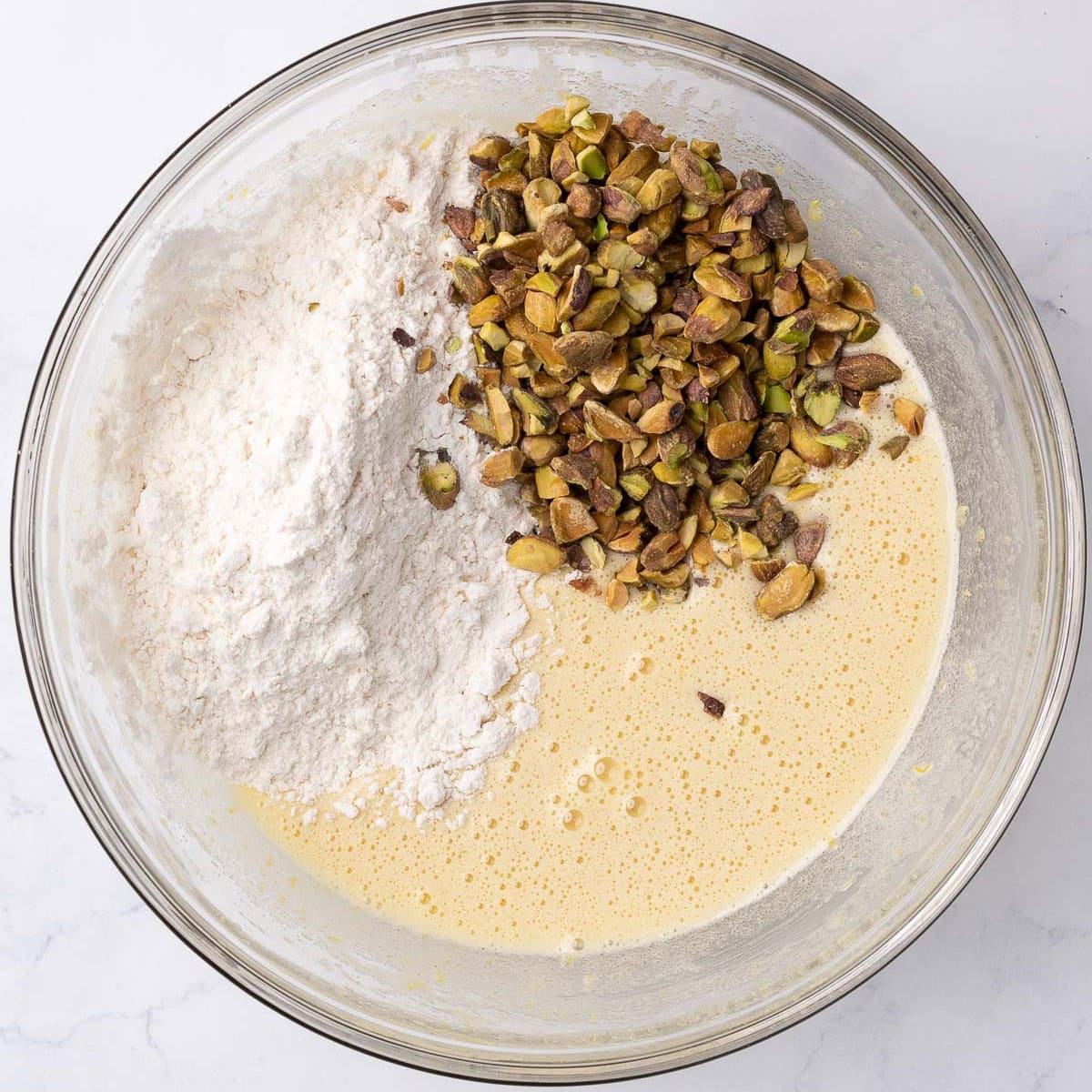 After combining with flour mixture added on top.