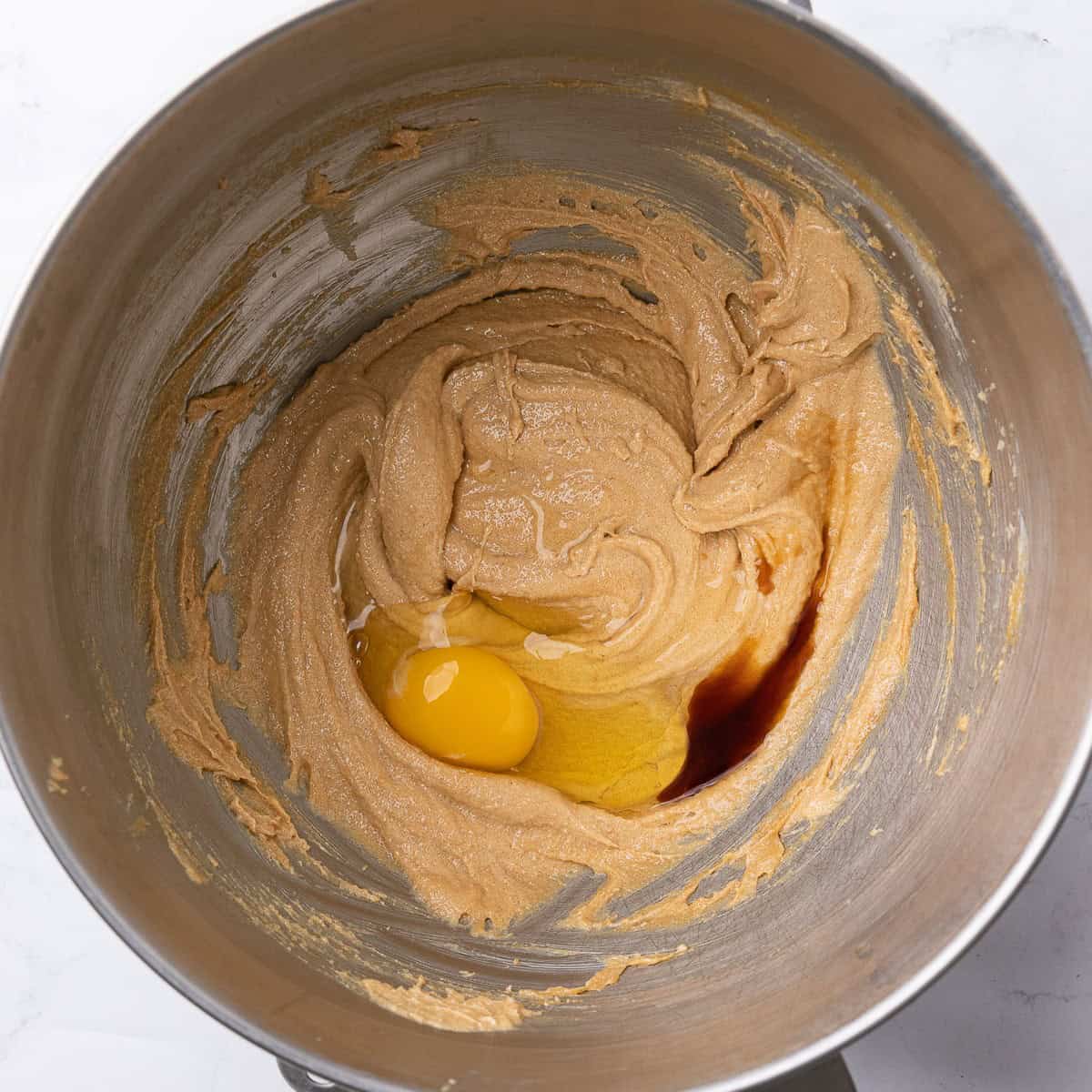 After creaming with an egg and vanilla added before mixing.