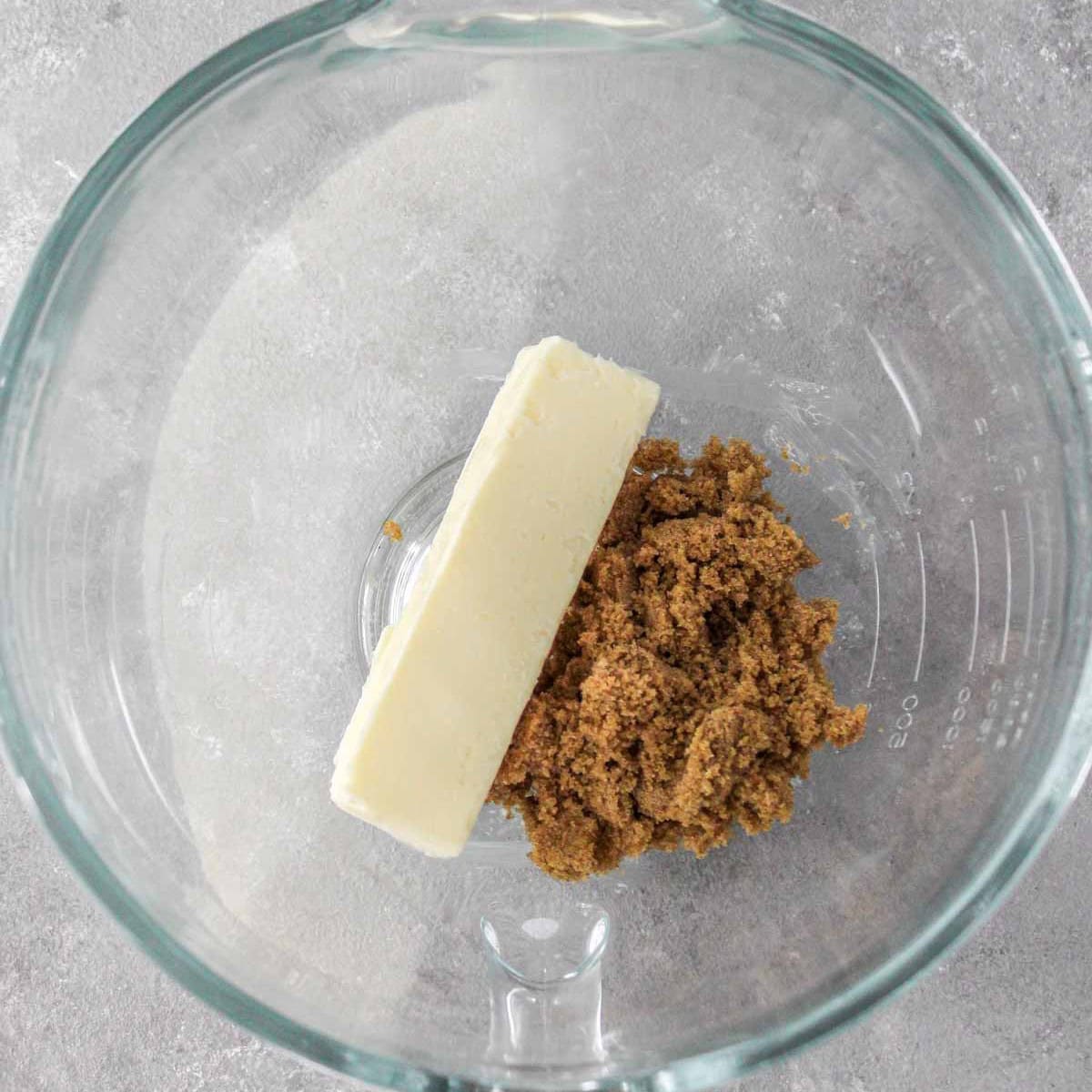 Butter and brown sugar in a bowl of stand mixer.