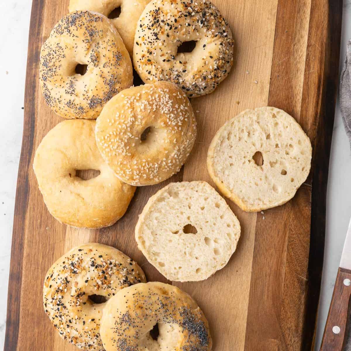 Homemade bagels on a cutting board.