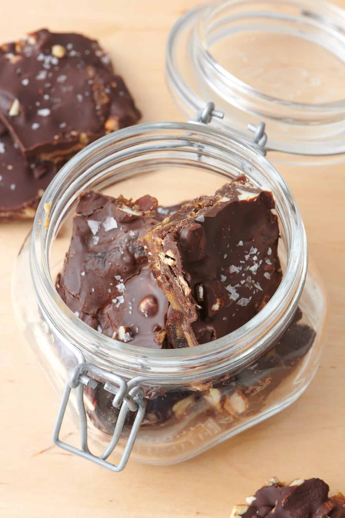 Homemade date bark in a glass jar for storage.