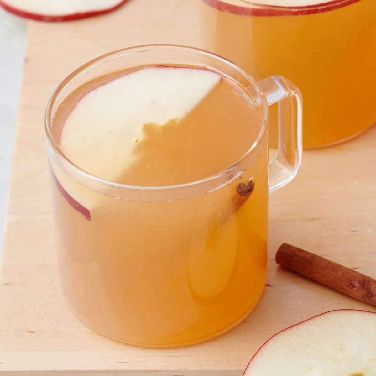 Homemade apple cider in a glass mug.