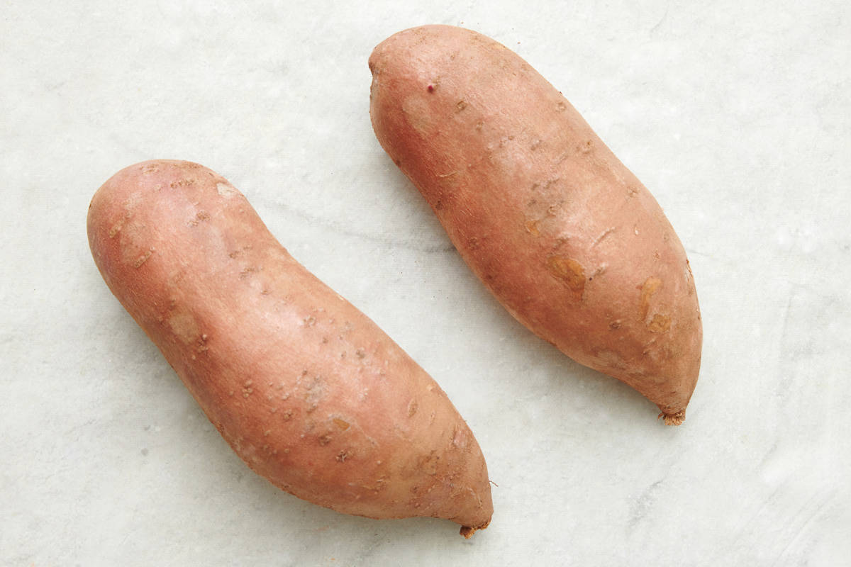 2 sweet potatoes on surface.