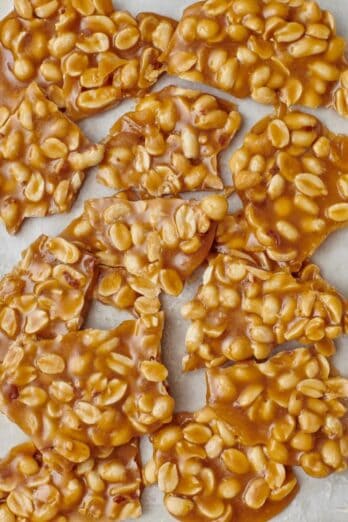 Square image of peanut brittle pieces.