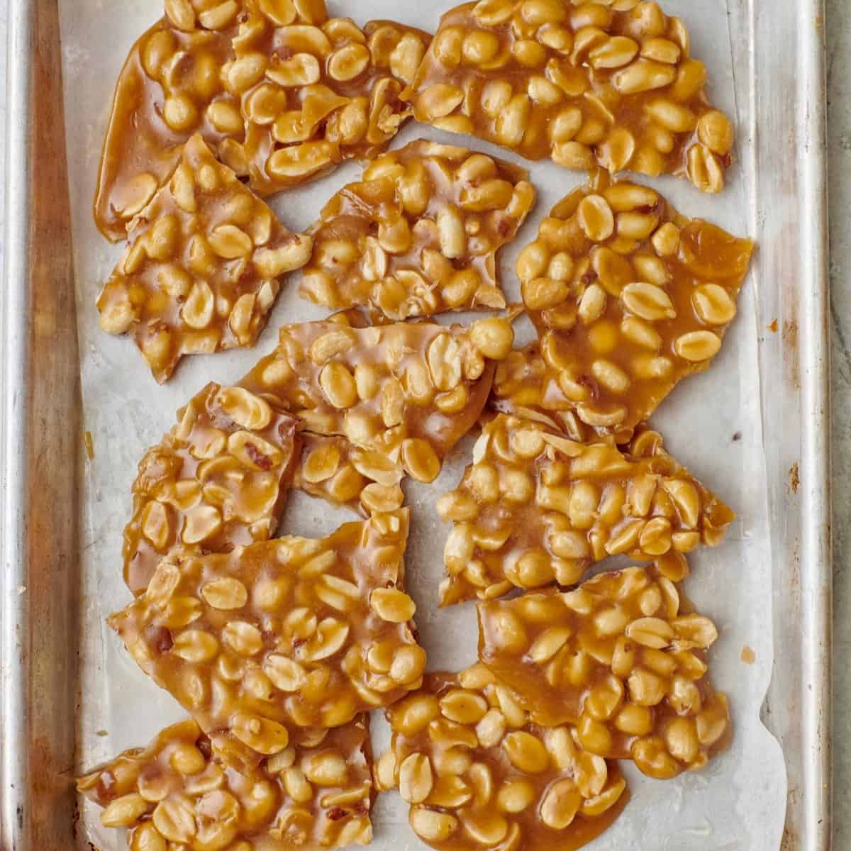 Square image of peanut brittle pieces.