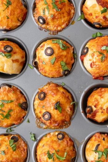 Pizza muffins in muffin pan.