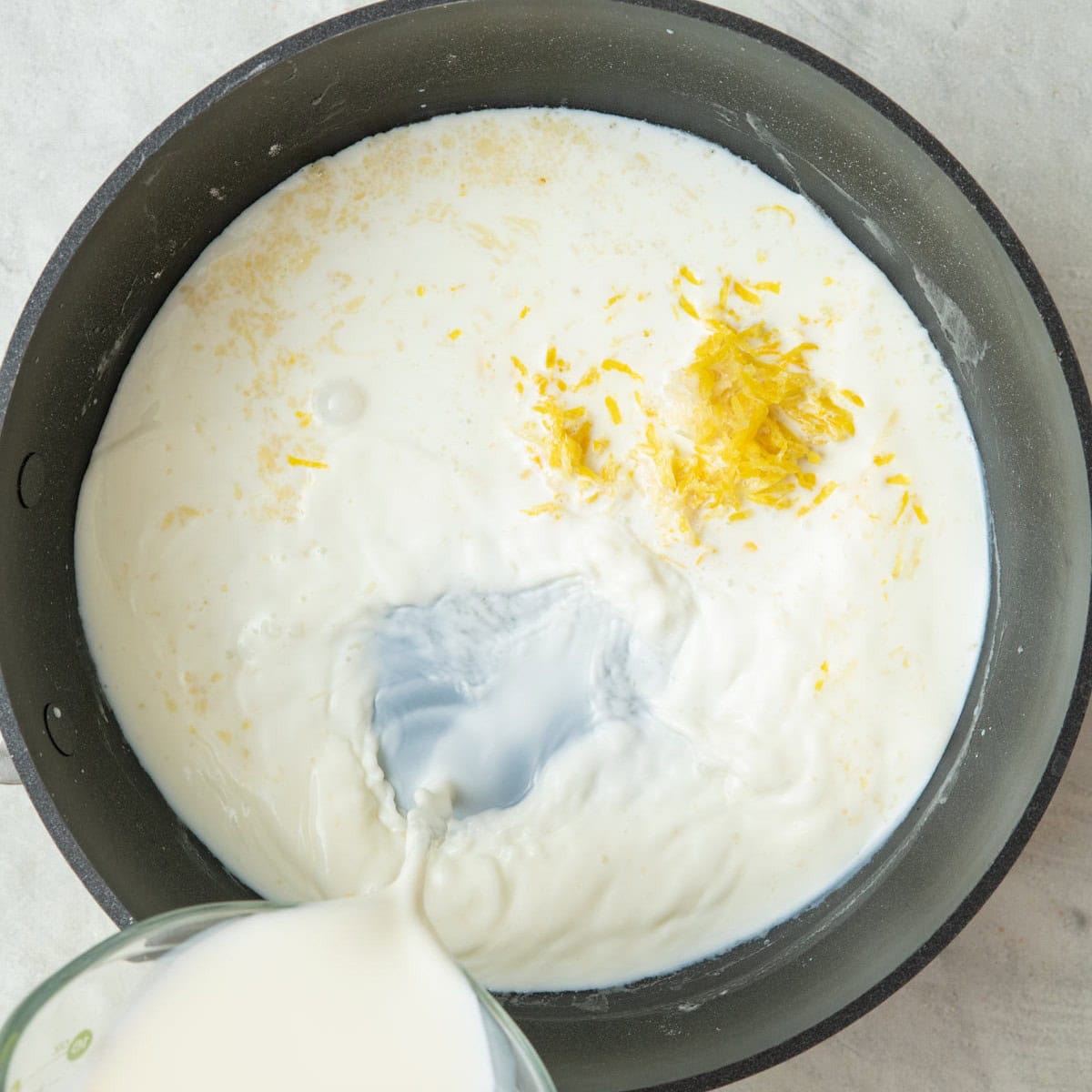 Milk, garlic and lemon zest added.