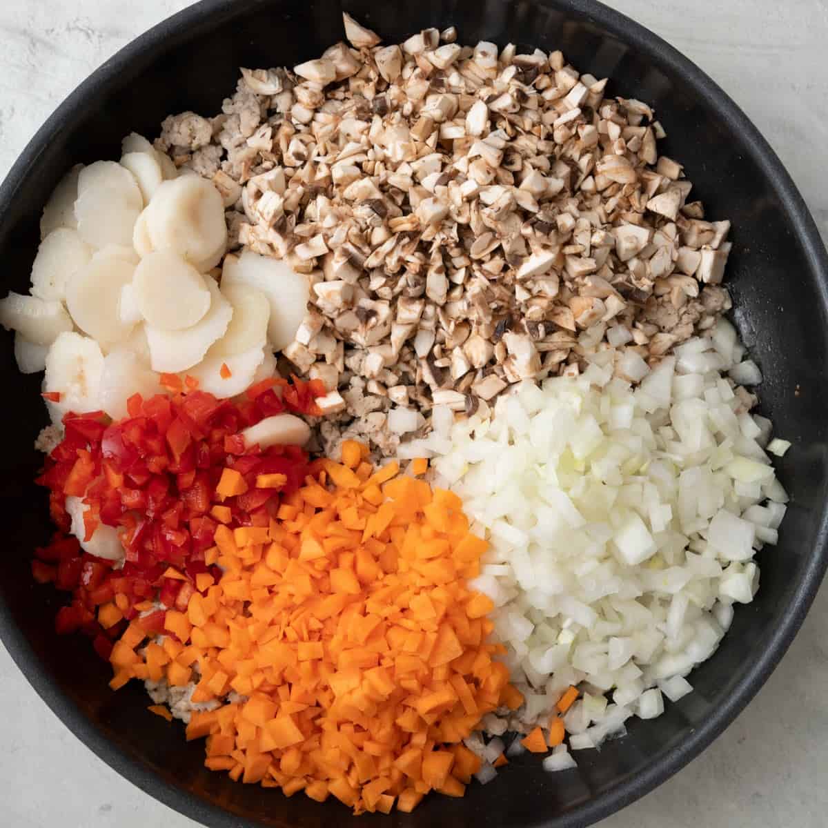 Onions, water chestnuts, mushrooms, carrots and peppers added before cooking.