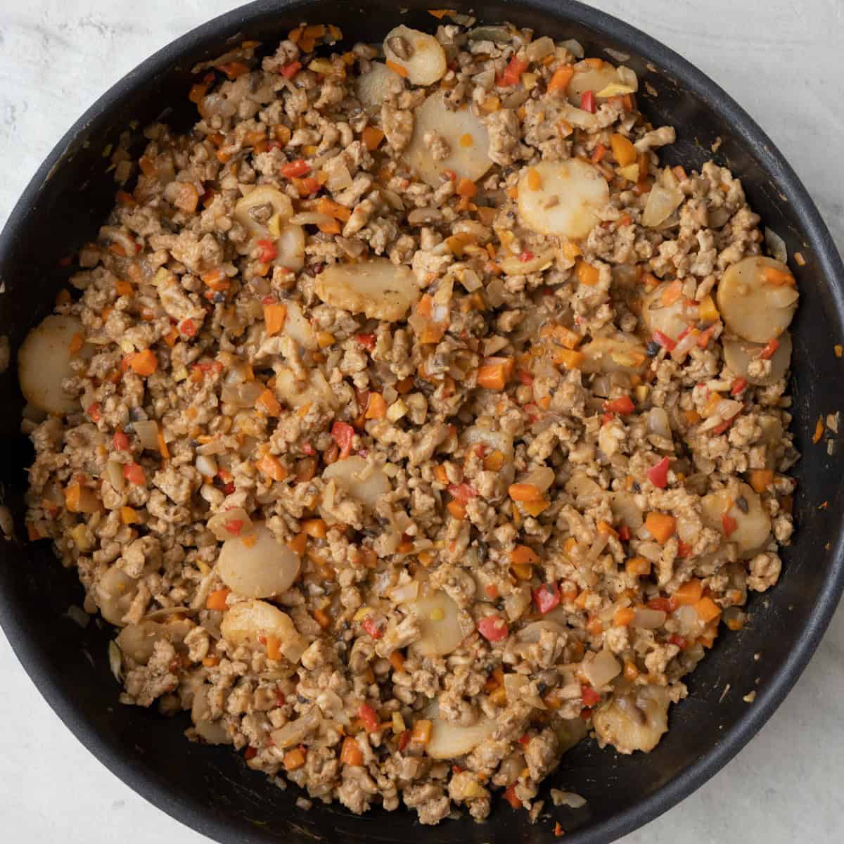 After everything is fully combined and coated with sauce.