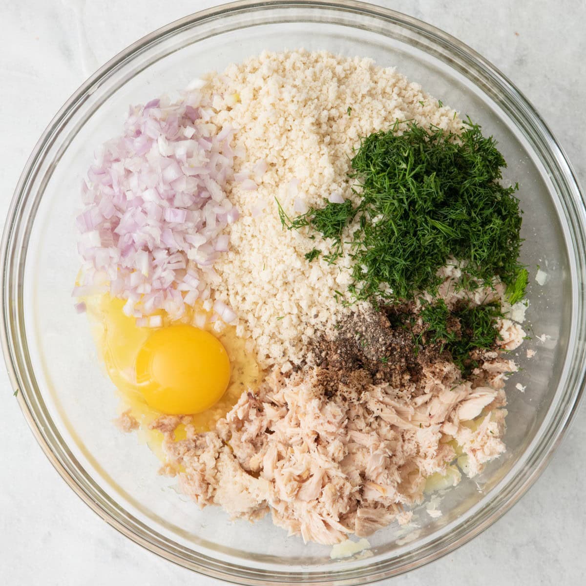 The rest of the ingredients added to the bowl with potatoes.