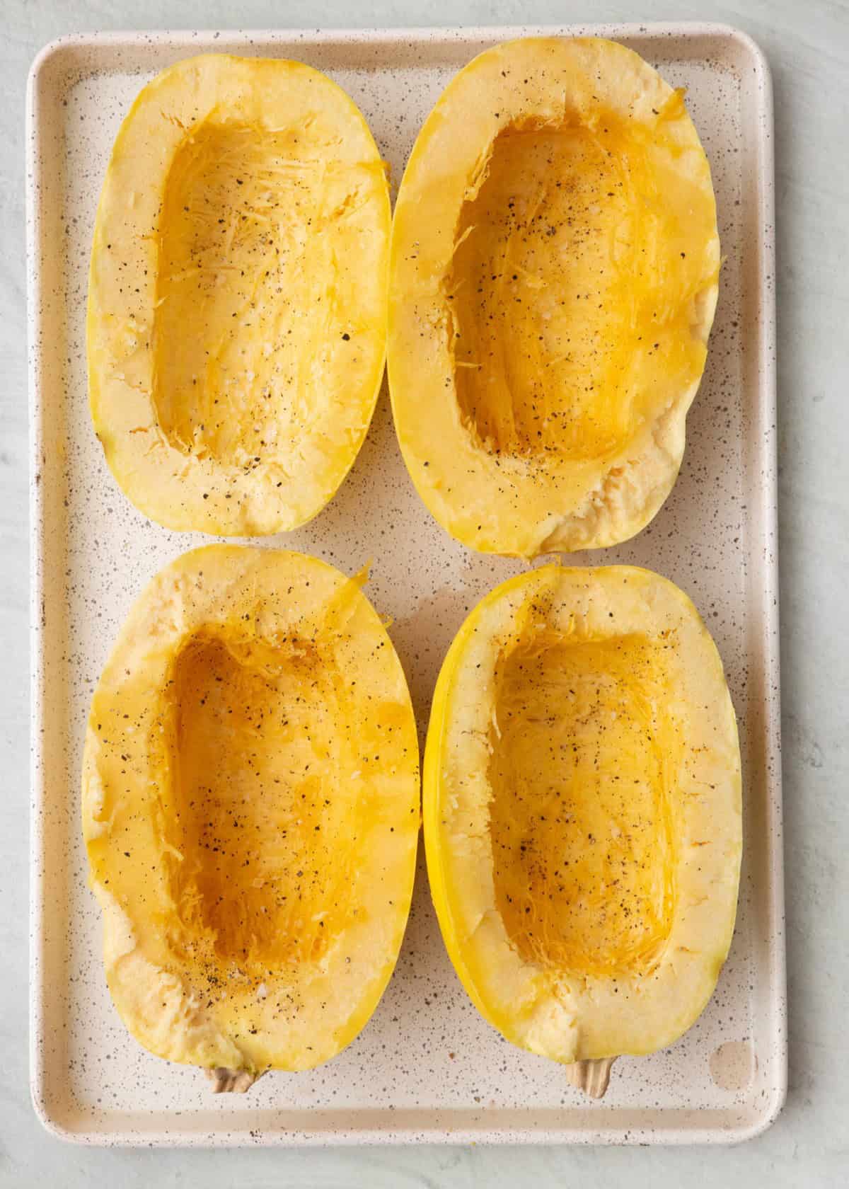 Insides of squash removed, seasonings added.