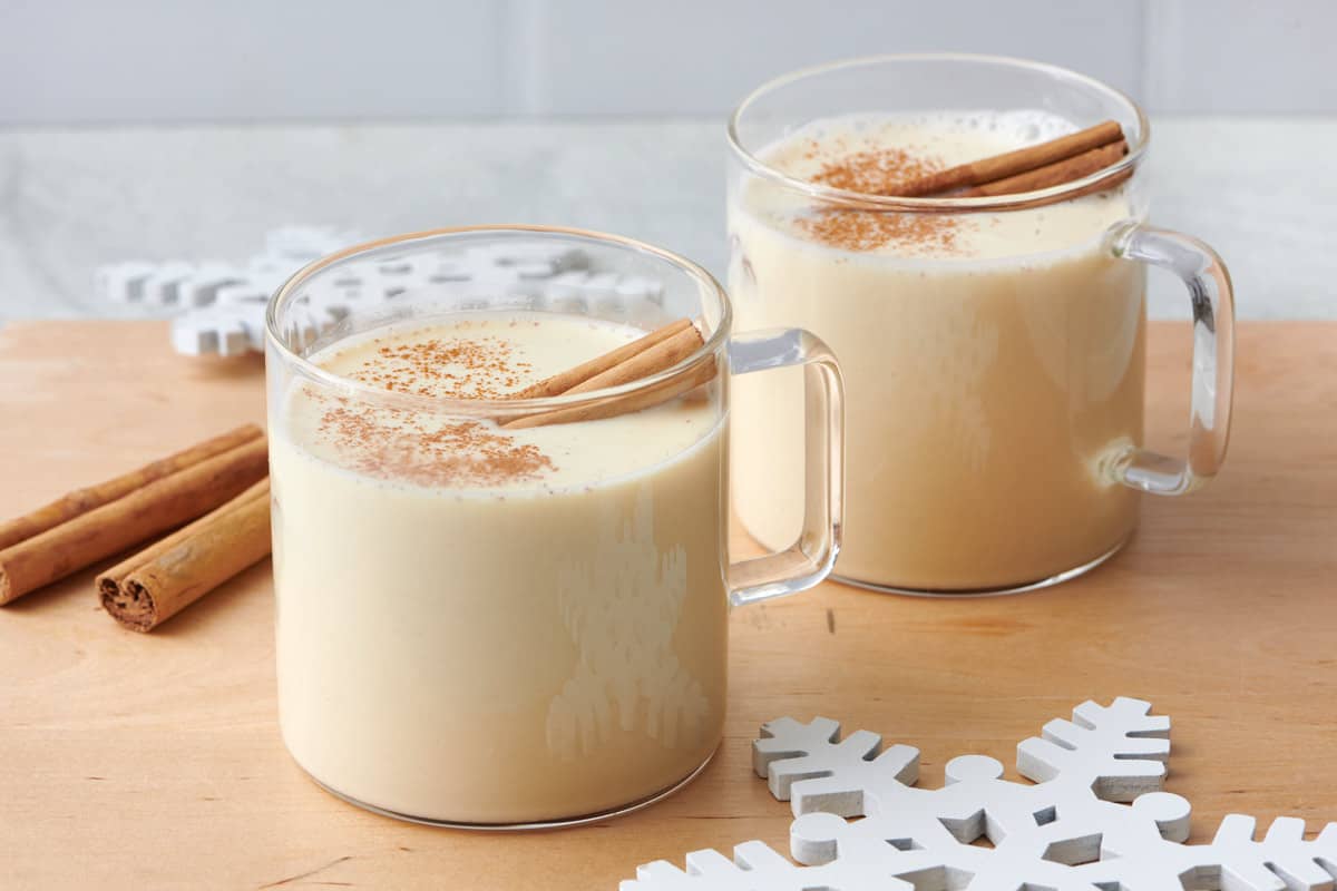 Recipe for how to make eggnog with it divided into two glasses.