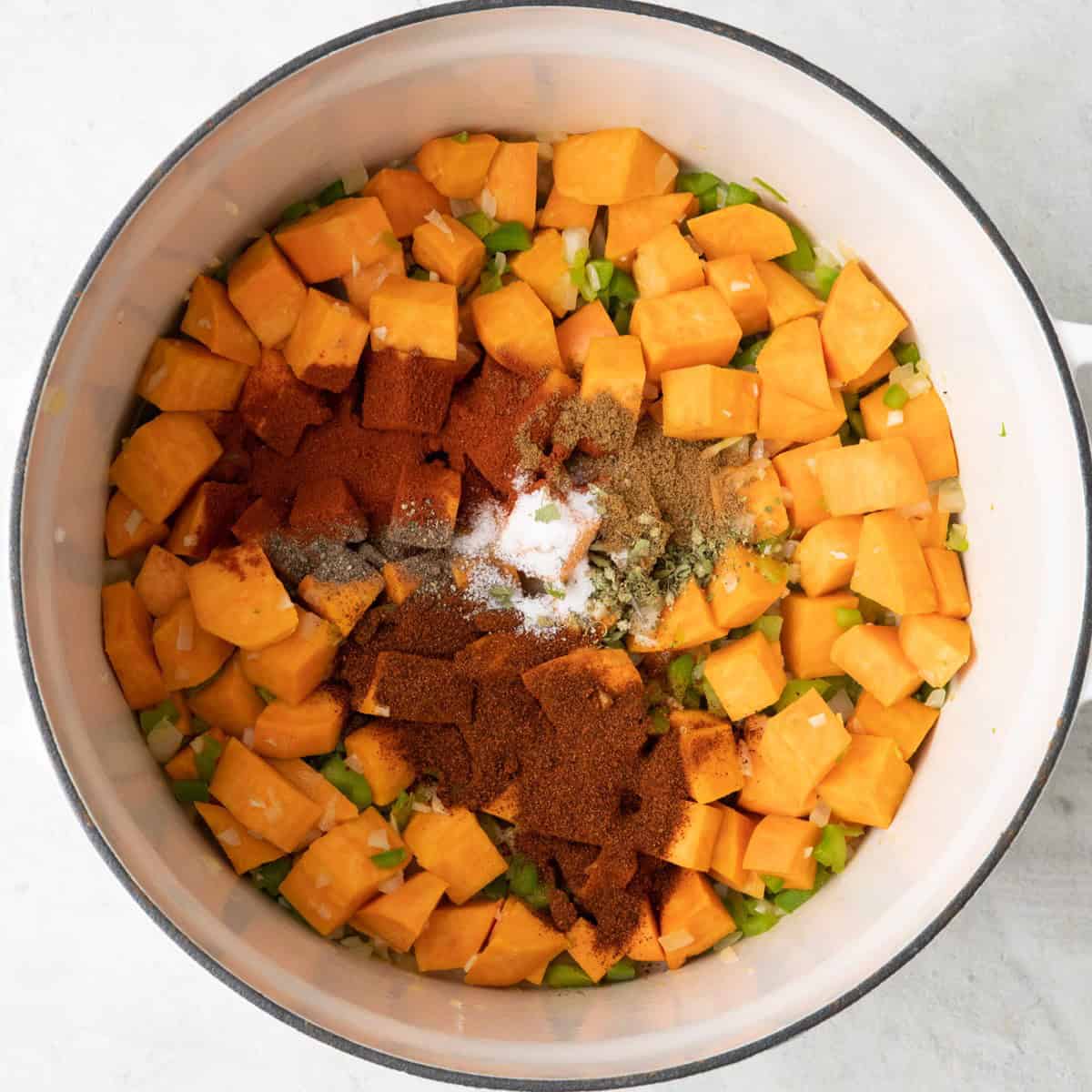 After cooking with chili powder, paprika, cumin, and oregano added before mixing.