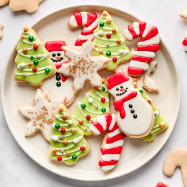 Christmas sugar cookies on a round plate.