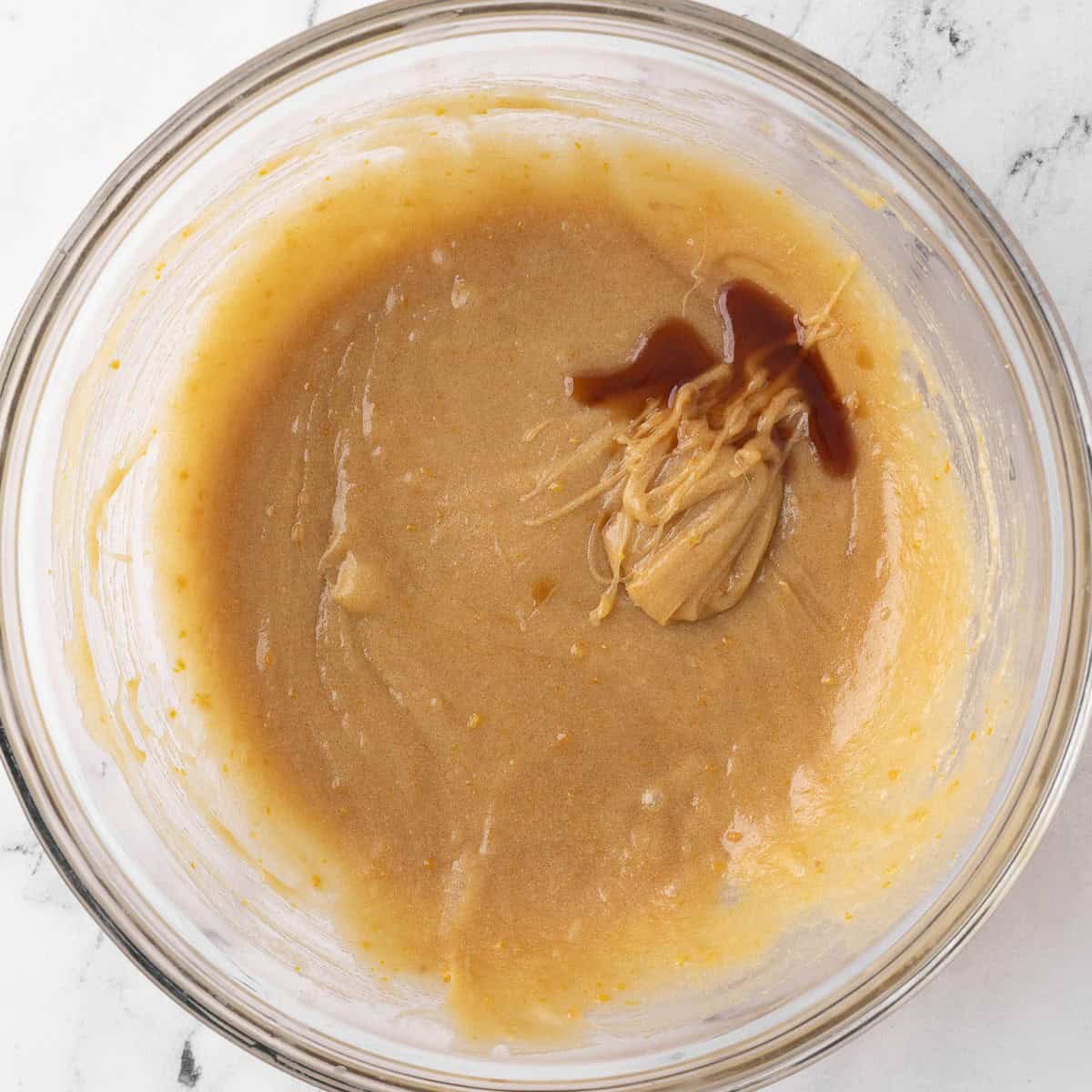 After all eggs are mixed in with vanilla added.