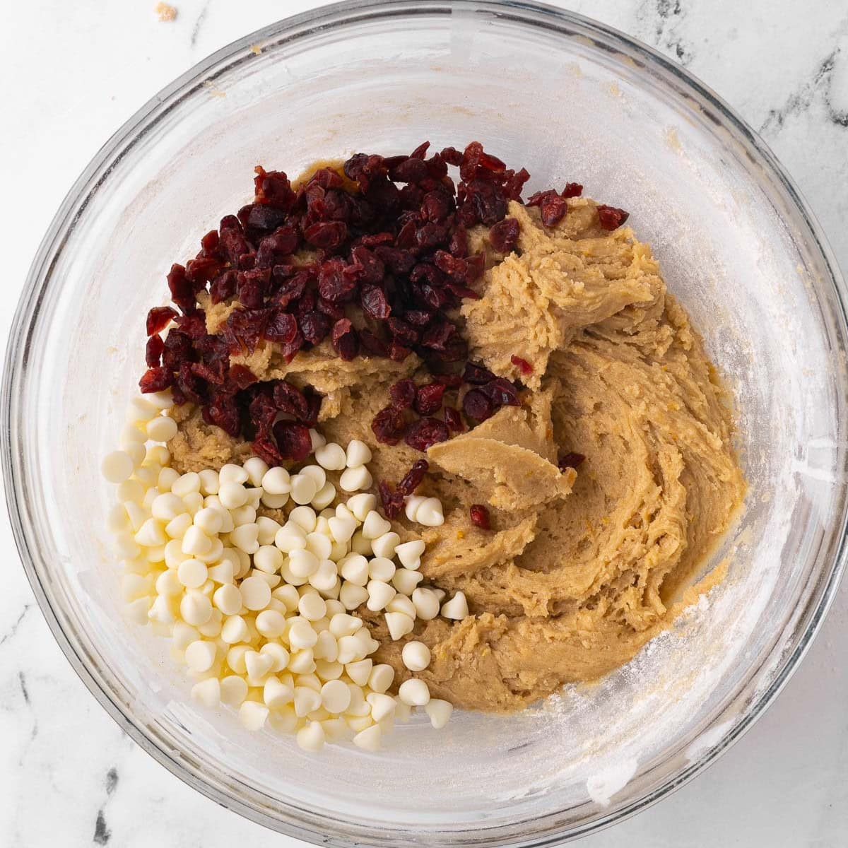 Dried cranberries and white chocolate chips added before combining.