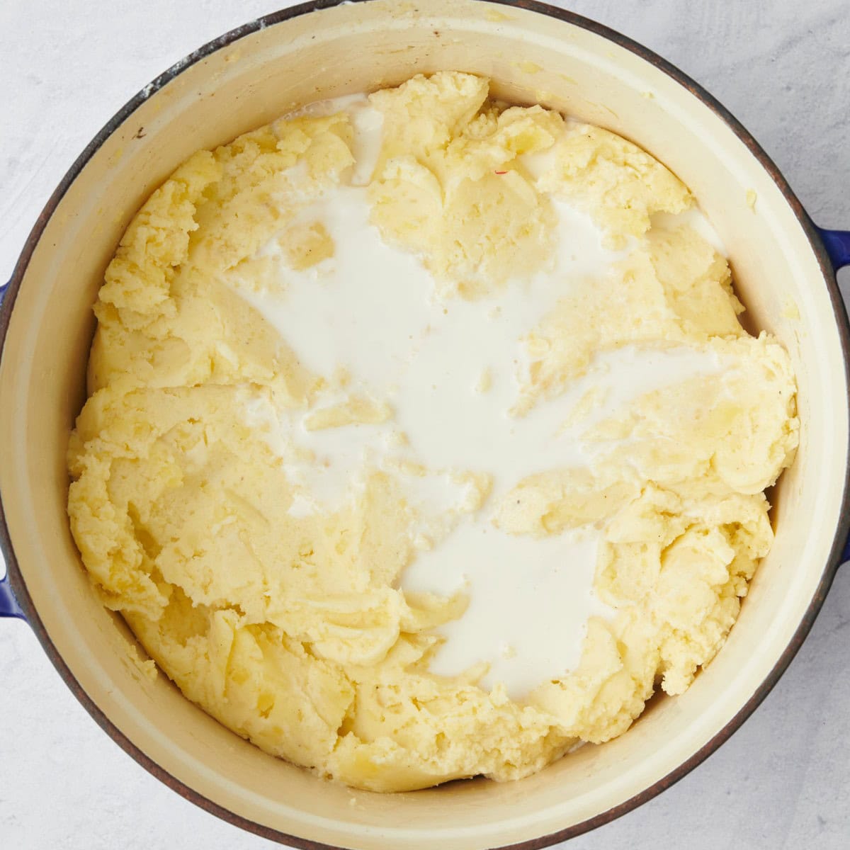 After mashing with milk added before combining.