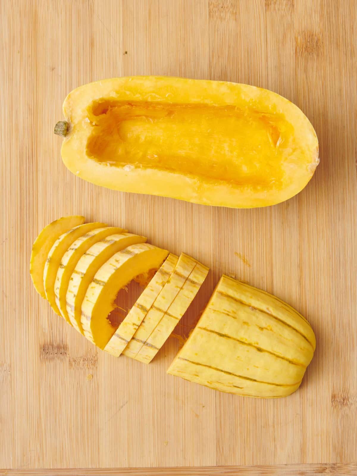 Half a squash cut side down slicing into ¼ inch thick slices.
