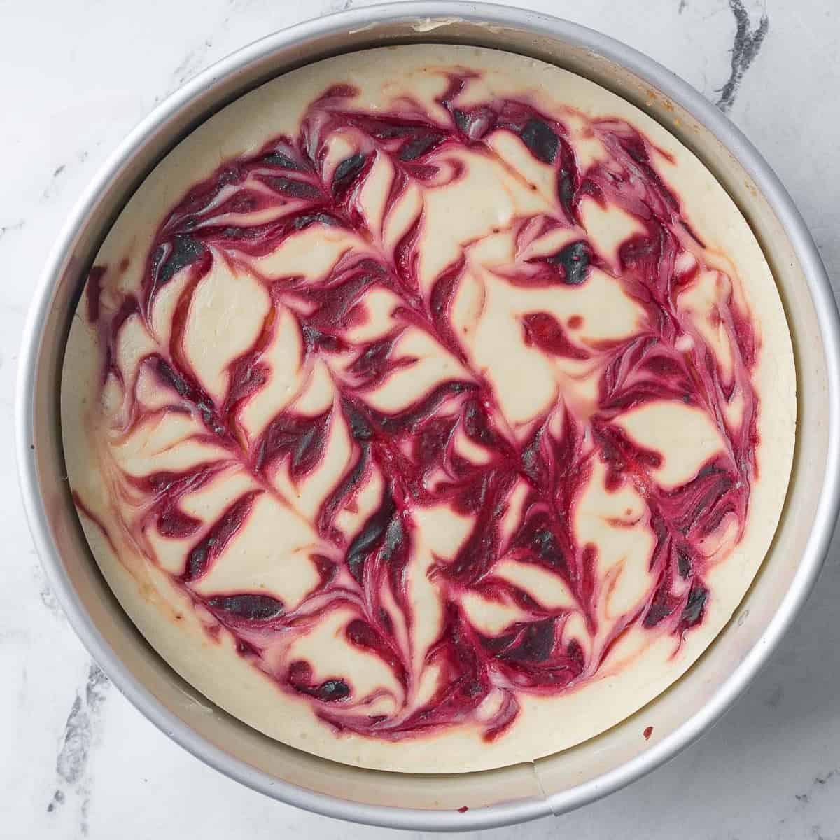 Cheesecake after baking and rested, still in pan.