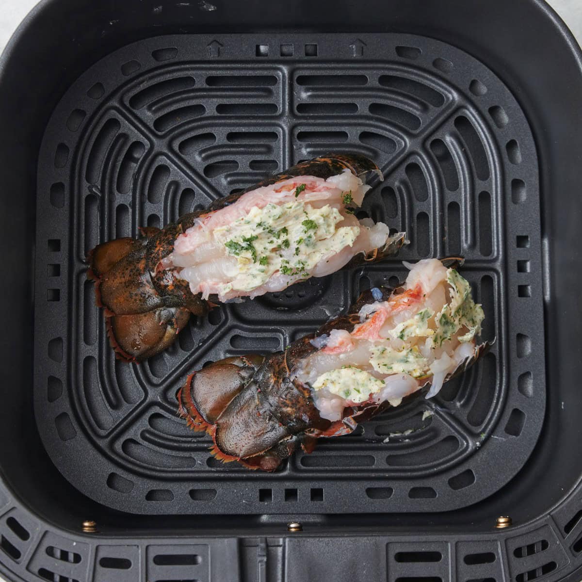 Prepared lobster tail before cooking.