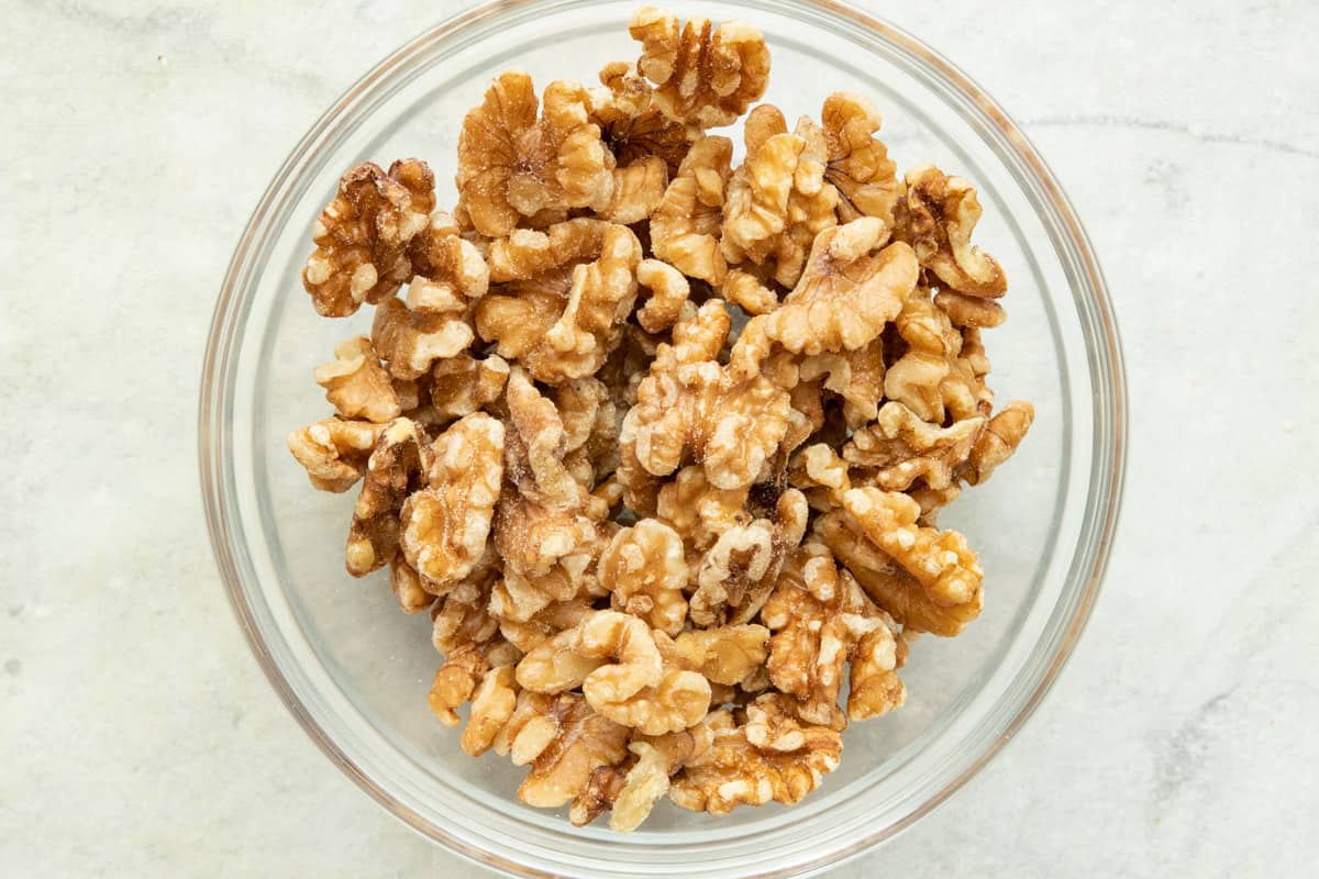 Bowl of raw walnut halves.