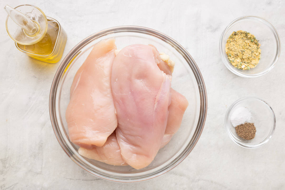 Ingredients for baked ranch chicken: Chicken breasts, olive oil, homemade ranch seasoning, salt, and black pepper.