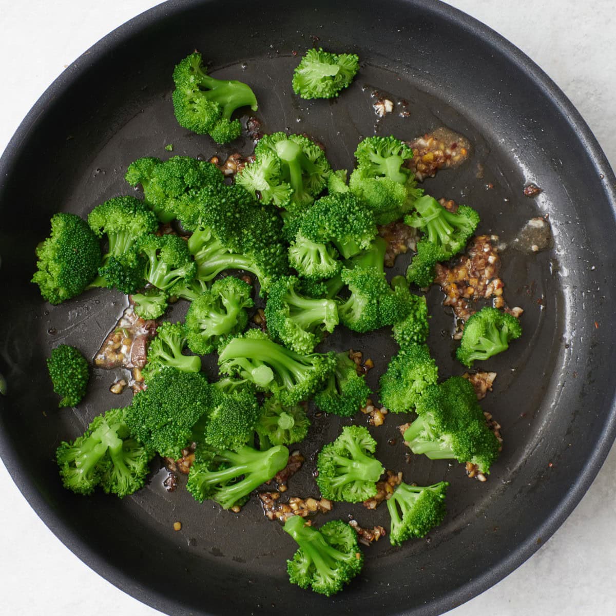 Broccoli added to the pan before frying.